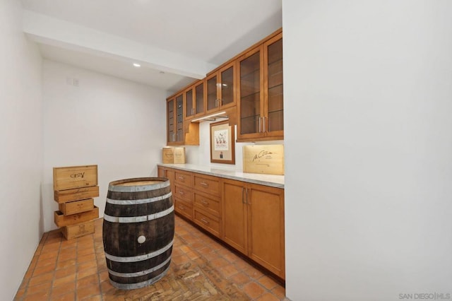 bar featuring lofted ceiling