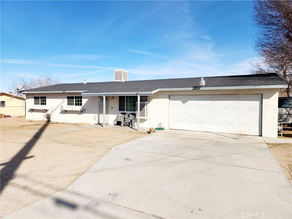 single story home with a garage