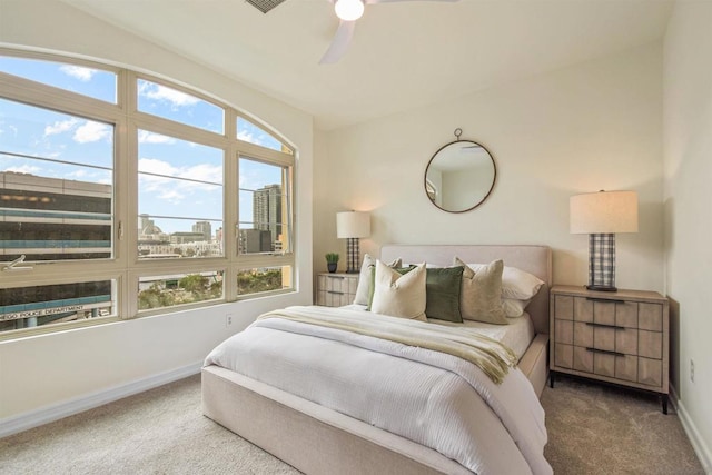 bedroom featuring ceiling fan and carpet floors