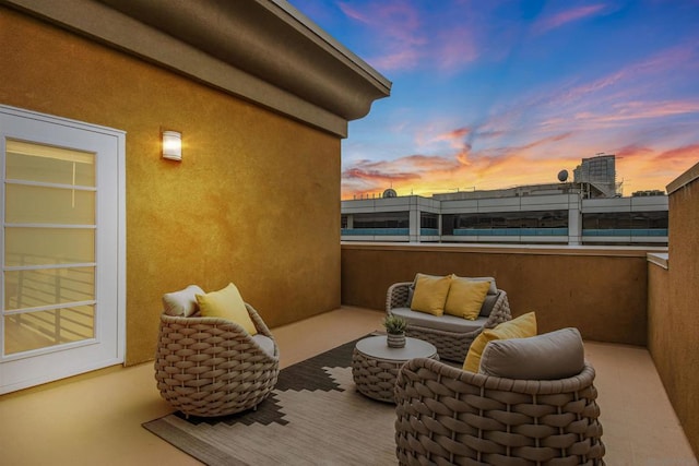 view of balcony at dusk