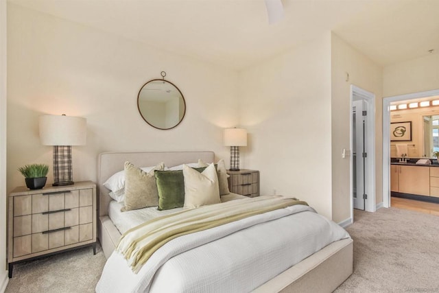 carpeted bedroom featuring connected bathroom