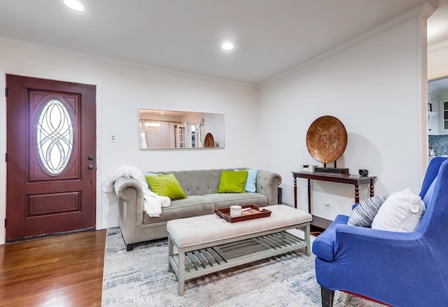 living room featuring crown molding and hardwood / wood-style floors