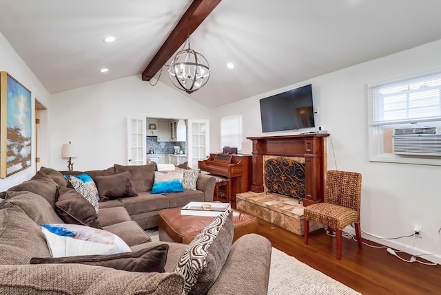 living room with vaulted ceiling with beams, hardwood / wood-style floors, a chandelier, and cooling unit