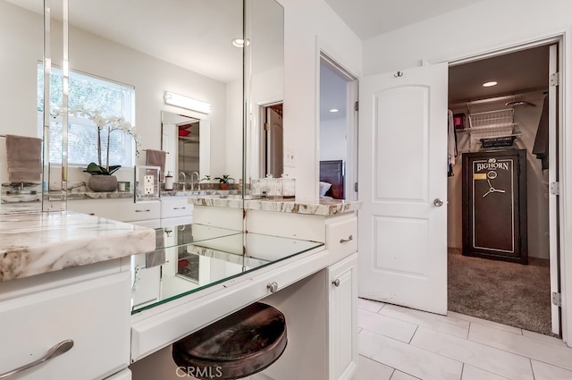 bathroom featuring tile patterned floors and vanity