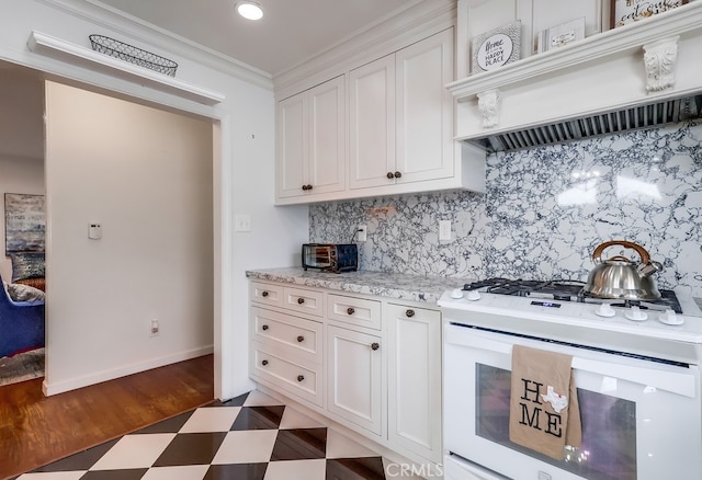 kitchen with white cabinets, backsplash, custom exhaust hood, ornamental molding, and white gas range oven