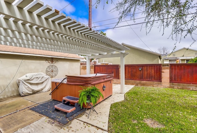 view of yard with a hot tub, a pergola, and a patio