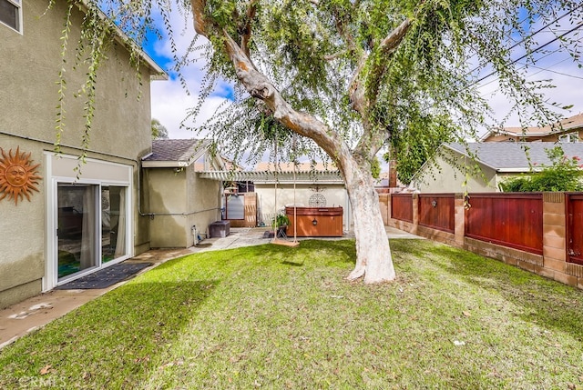 view of yard with a hot tub, a pergola, and a patio area