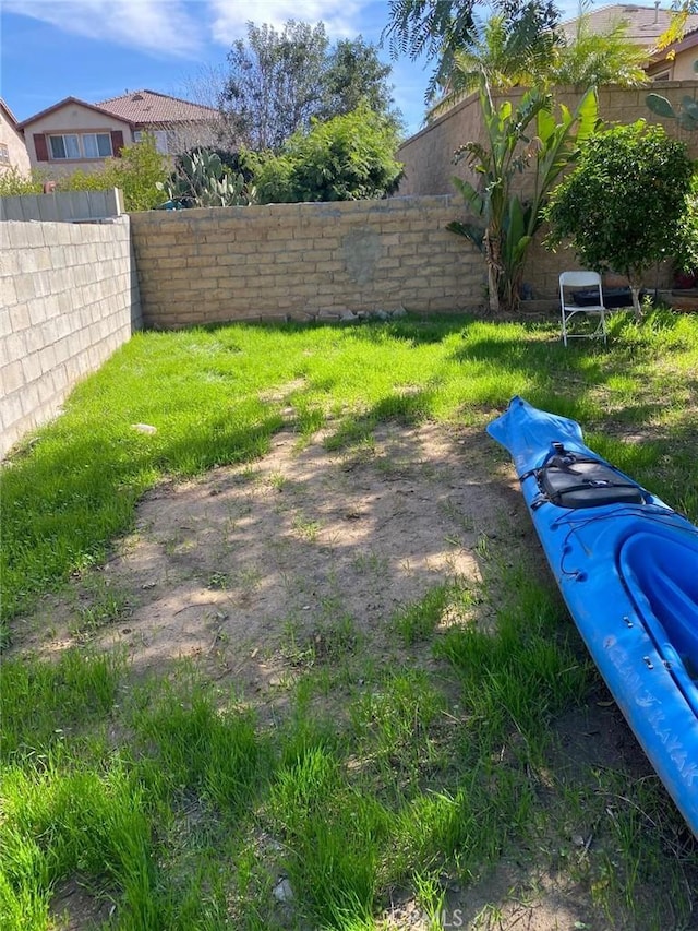 view of yard featuring a fenced backyard