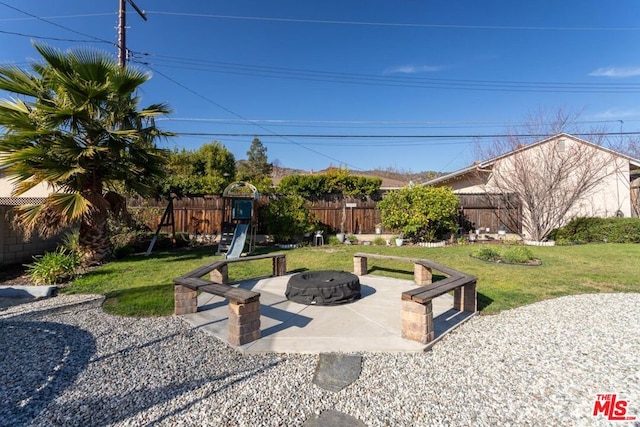 view of patio / terrace with an outdoor fire pit