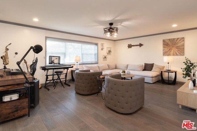 living room featuring dark hardwood / wood-style flooring and ornamental molding