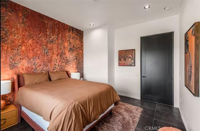 bedroom with dark tile patterned flooring