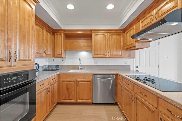 kitchen featuring crown molding, light hardwood / wood-style floors, sink, and black appliances