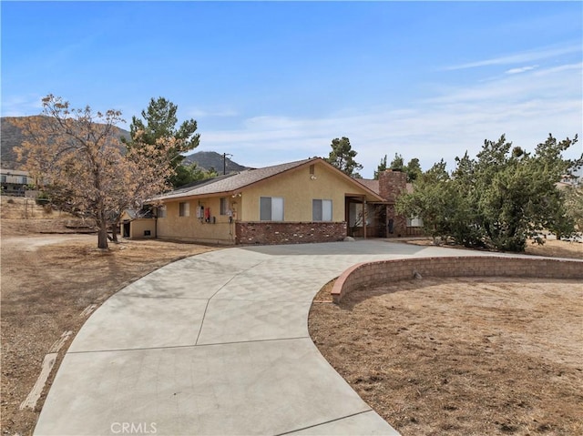 single story home with a mountain view