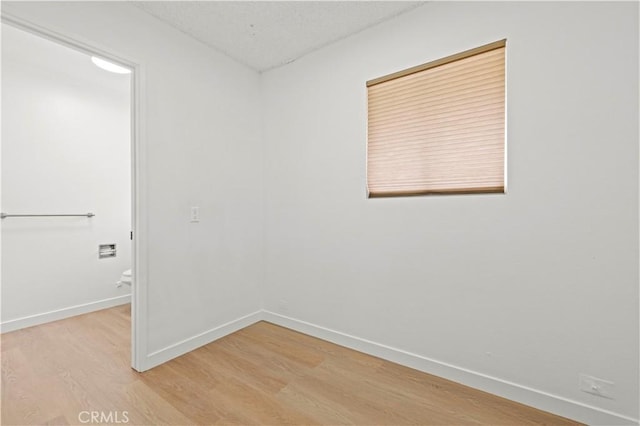 unfurnished room featuring hardwood / wood-style floors