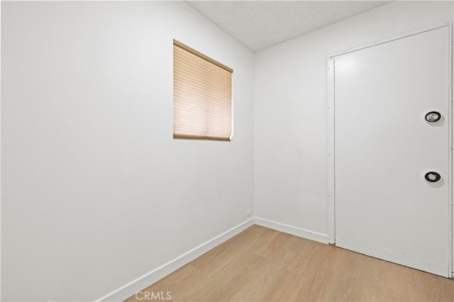 spare room featuring light wood-type flooring