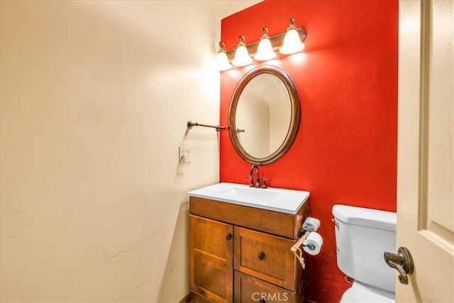 bathroom with vanity and toilet