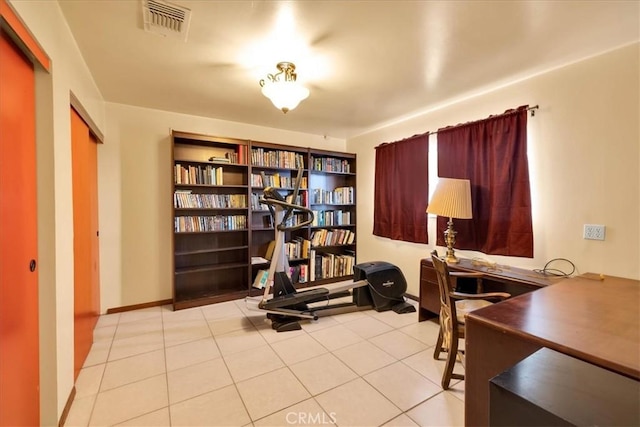 office featuring built in features and light tile patterned floors