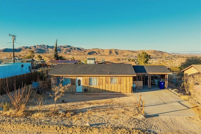 view of front of house featuring a mountain view and a carport