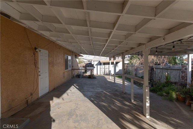 wooden deck featuring a patio area and fence