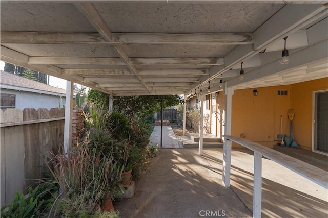 view of patio / terrace featuring fence