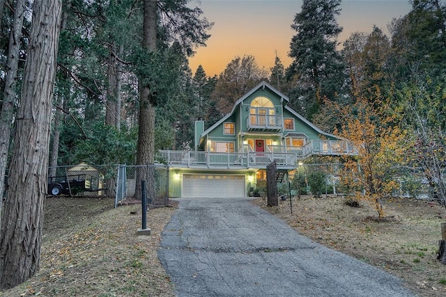 view of front of home featuring a garage and covered porch