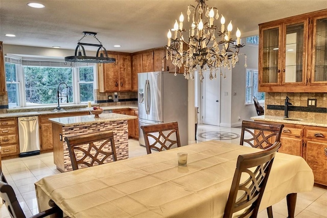 dining room with sink and light tile patterned floors