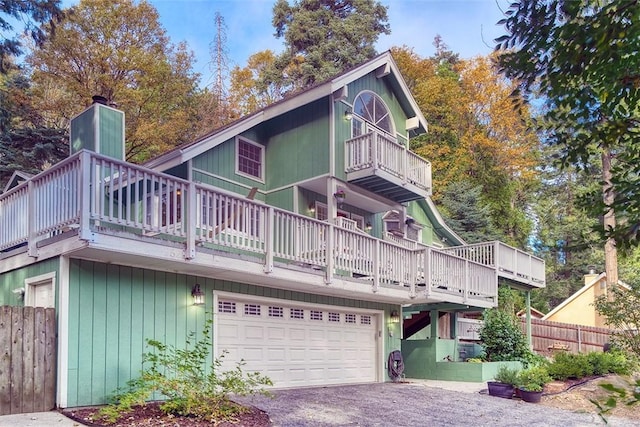 back of property featuring a garage