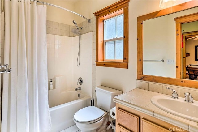 full bathroom with tasteful backsplash, vanity, shower / bathtub combination with curtain, and toilet