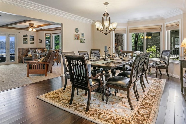 dining room with beam ceiling, ornamental molding, ceiling fan with notable chandelier, and dark hardwood / wood-style flooring