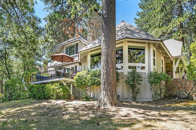 view of side of home featuring a deck