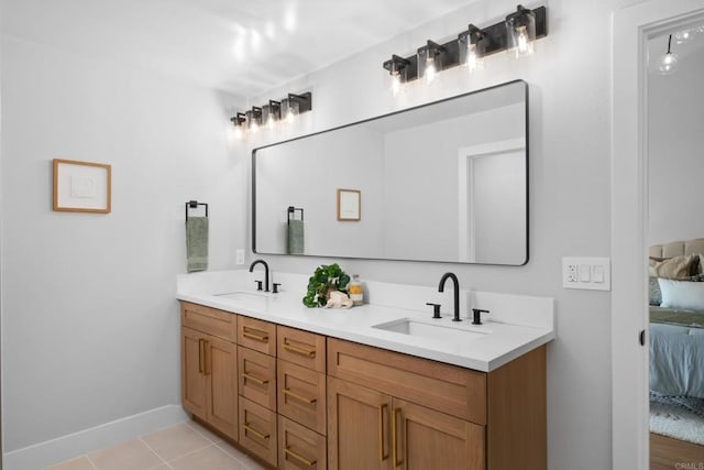 bathroom with tile patterned floors and vanity