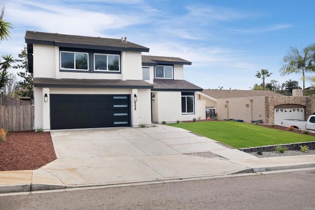 view of front of home featuring a garage and a front lawn