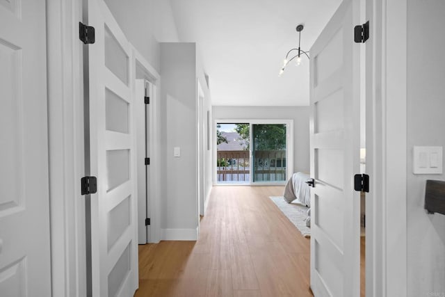 corridor with light wood-type flooring