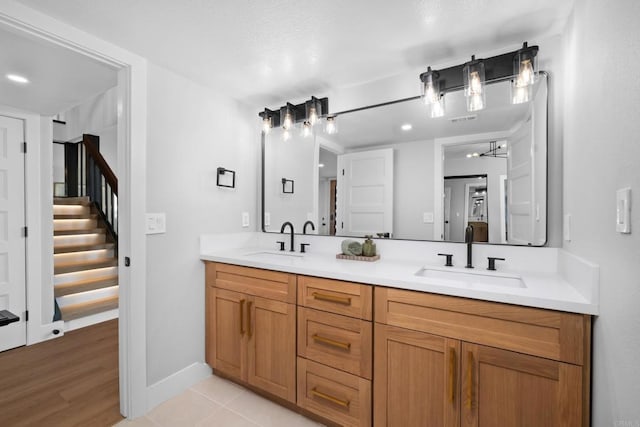 bathroom with tile patterned flooring and vanity