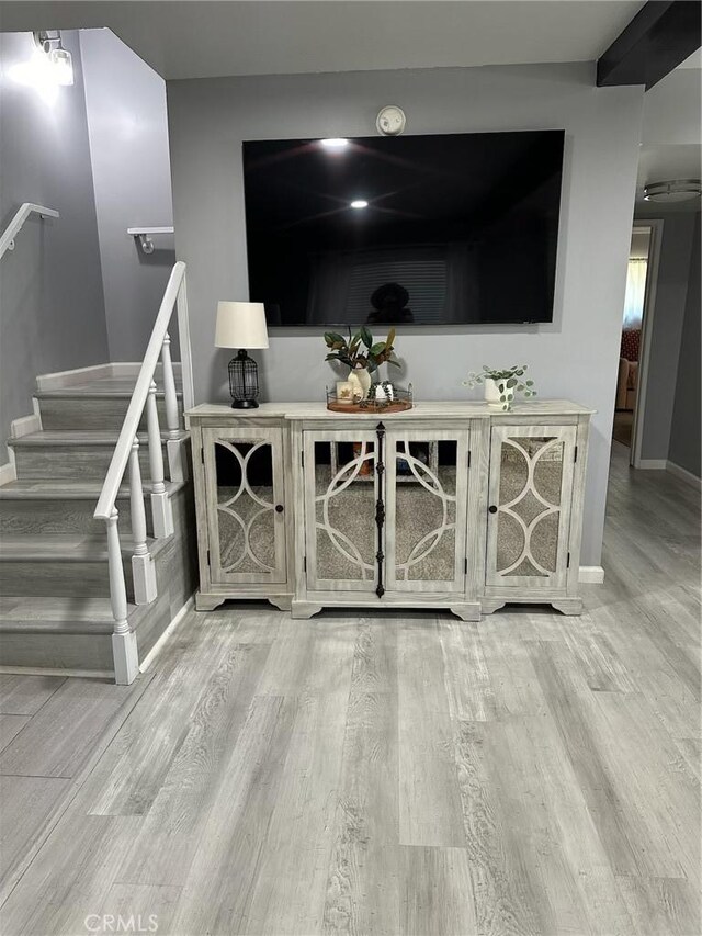 unfurnished living room with light hardwood / wood-style flooring