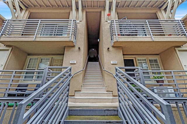 entrance to property featuring a balcony