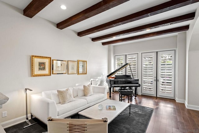 living room with beamed ceiling, dark hardwood / wood-style floors, and french doors