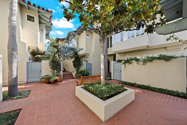 exterior space featuring a patio area and a pergola