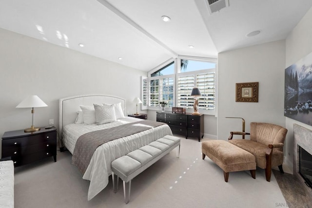 bedroom with light colored carpet and lofted ceiling with beams