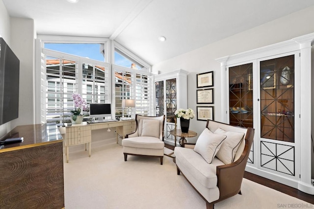 office area with vaulted ceiling with beams