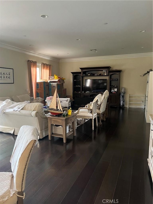 living room featuring crown molding and dark hardwood / wood-style floors