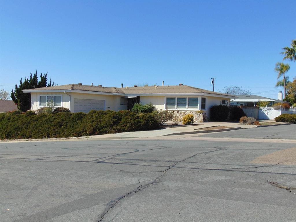 ranch-style home with a garage