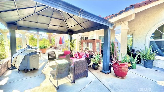 view of patio / terrace with a gazebo and an outdoor hangout area