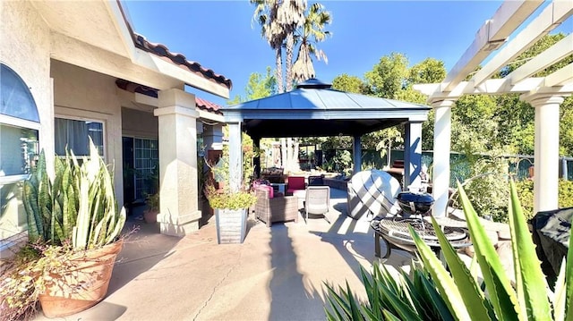 view of patio featuring a pergola, a gazebo, and an outdoor hangout area