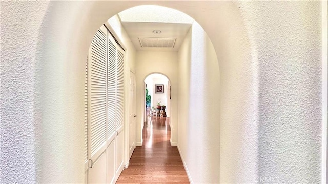 corridor featuring hardwood / wood-style floors