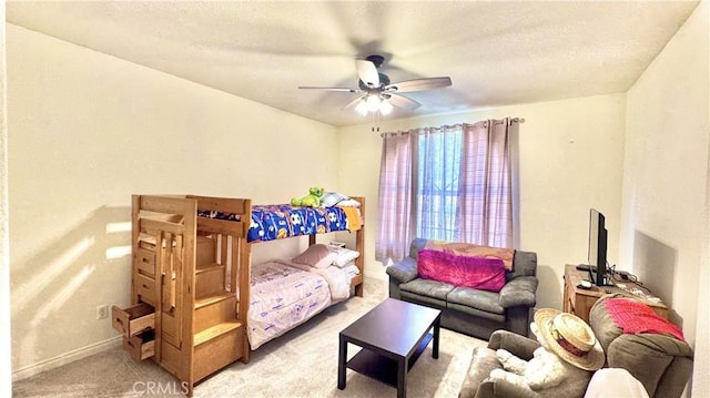 bedroom with light carpet and ceiling fan