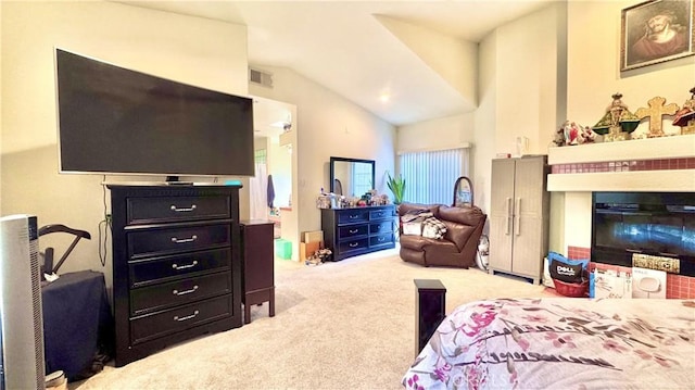 carpeted bedroom with vaulted ceiling