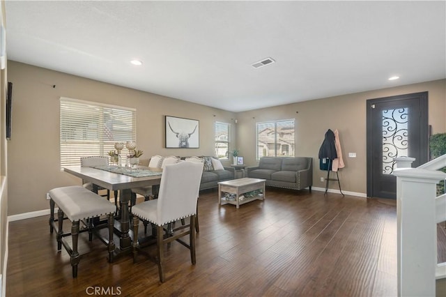 dining area with dark hardwood / wood-style floors