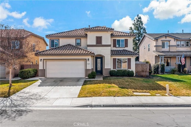 mediterranean / spanish home featuring a garage and a front yard