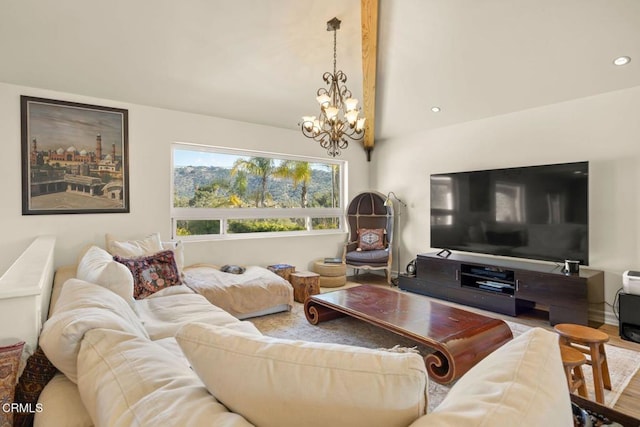 living room with hardwood / wood-style flooring, vaulted ceiling, and a notable chandelier